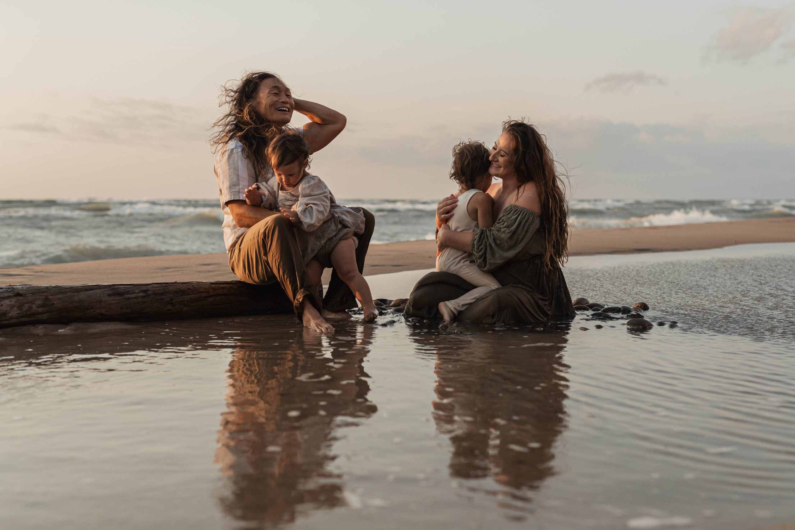 Families like to go with the flow during family photo sessions. They often play in the water during beach sessions.