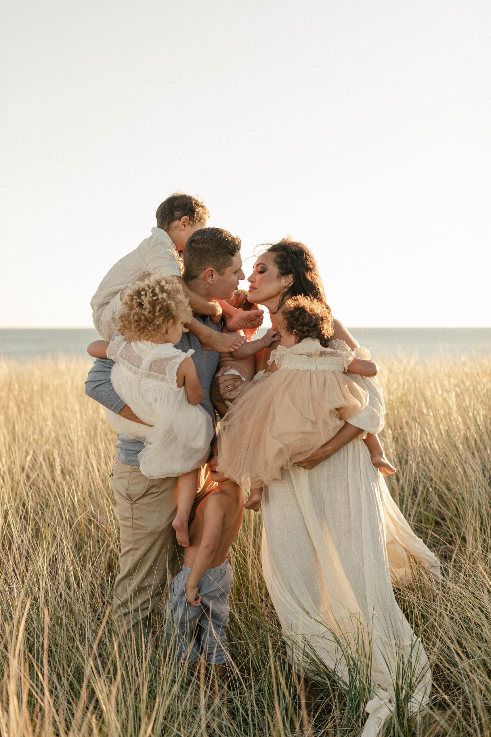 photo of a large family in the dunes of lake michigan