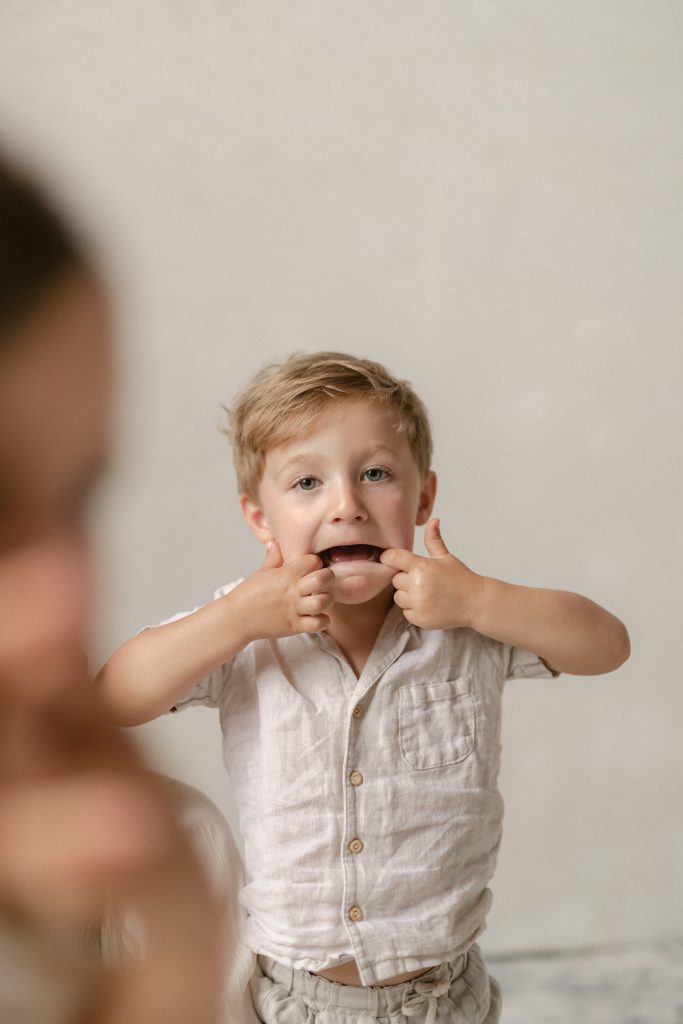 little boy making silly face at the camera