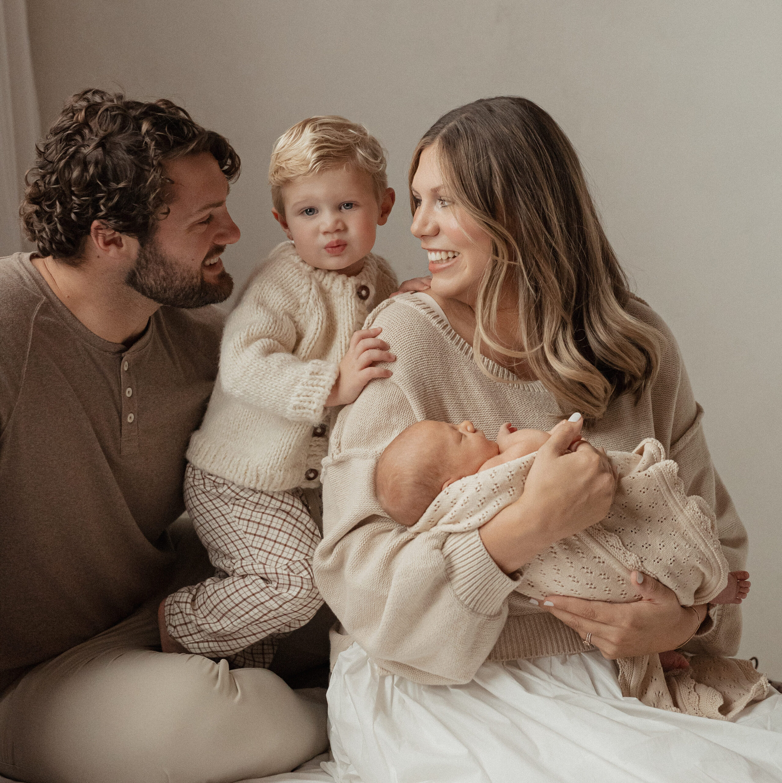 West Michigan family dressed in casual neutrals for a natural light newborn session with Alissa Saylor