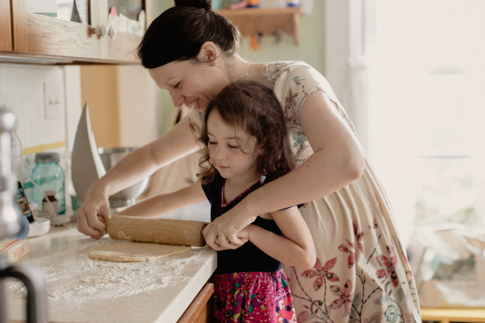 Mom and daughter baking during a family lifestyle photoshoot 